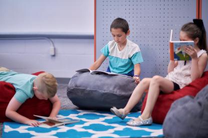 Students sitting on bean bag chairs
