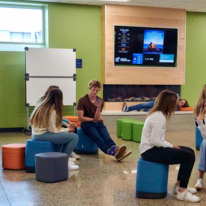 Students sitting in common area.