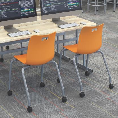 Evoke chairs at table for computers.