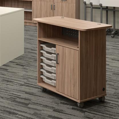 Rolling cart with drawers for storage.