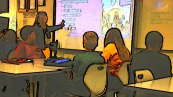 Teacher pointing at a projector screen