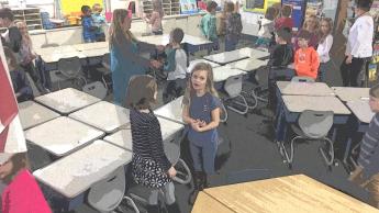 Classroom bustling with young students